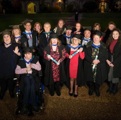 Ruby Walsh (back right) joins lecturers and fellow peer buddies to celebrate the graduation of UCC id+ project students.