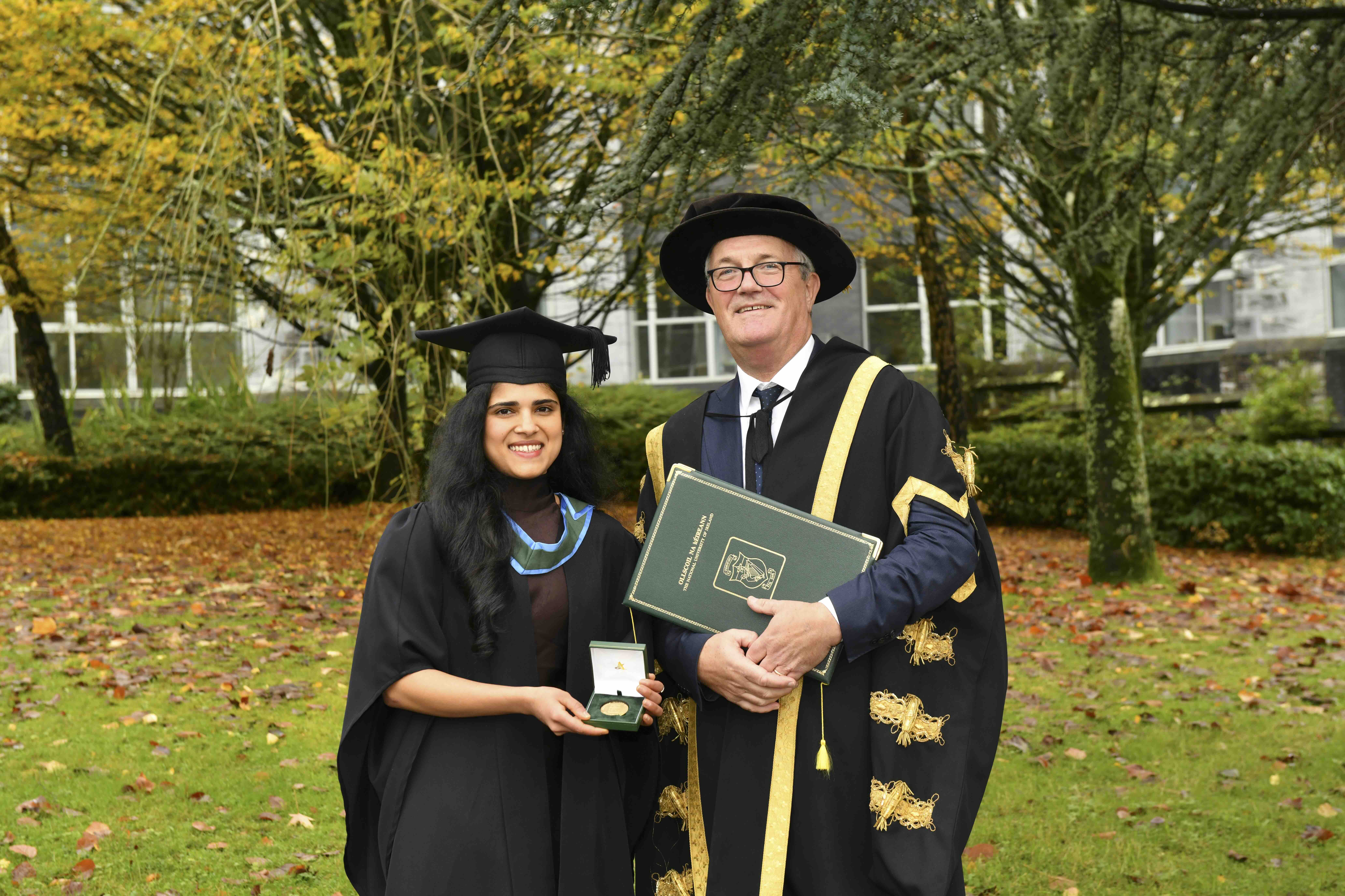 Iris Carvalho with UCC President at graduation receiving an award Iris Carvalho with UCC President at graduation receiving an award