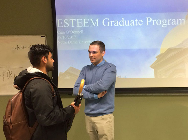 Cian O’Donnell discussing the ESTEEM programme with a student