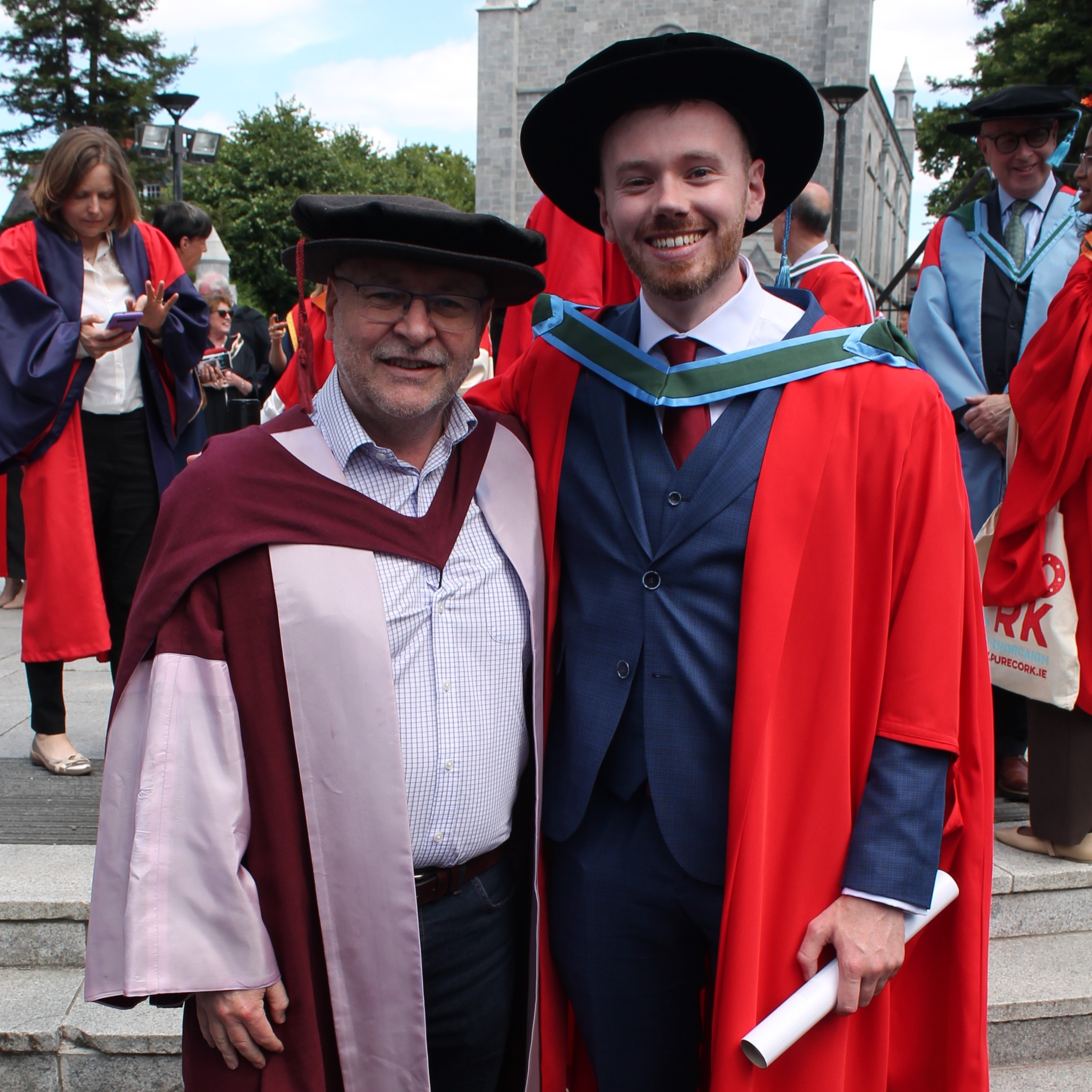 Graduate Dr Niall O'Sullivan and his supervisor, Prof. John Wenger, pose among the conferring crowd.