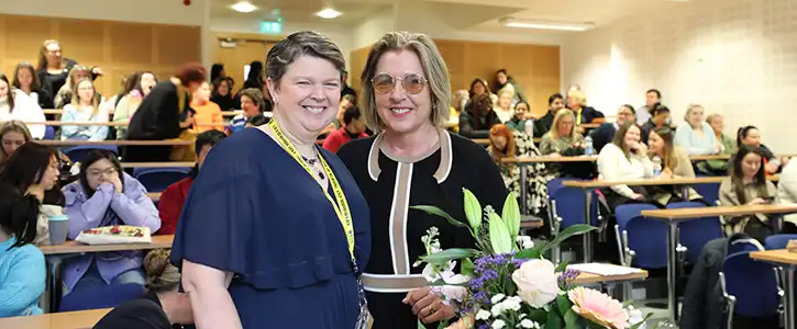 Professor Josephine Hegarty is presented with flowers at Research Conference Professor Josephine Hegarty is presented with flowers at Research Conference