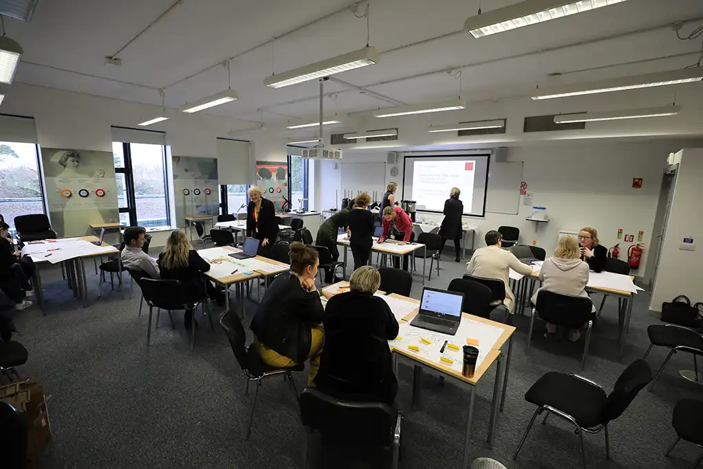 Attendees at the Nursing research conference world cafe session in a teaching room in UCC School of Nursing and Midwifery Attendees at the Nursing research conference world cafe session in a teaching room in UCC School of Nursing and Midwifery