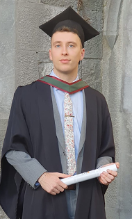 Graduate holding a parchment Graduate holding a parchment