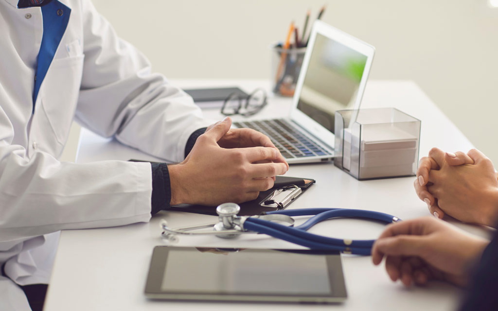 Doctor's hands on desk