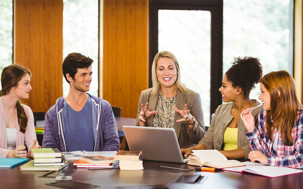 A teacher in conversation with students