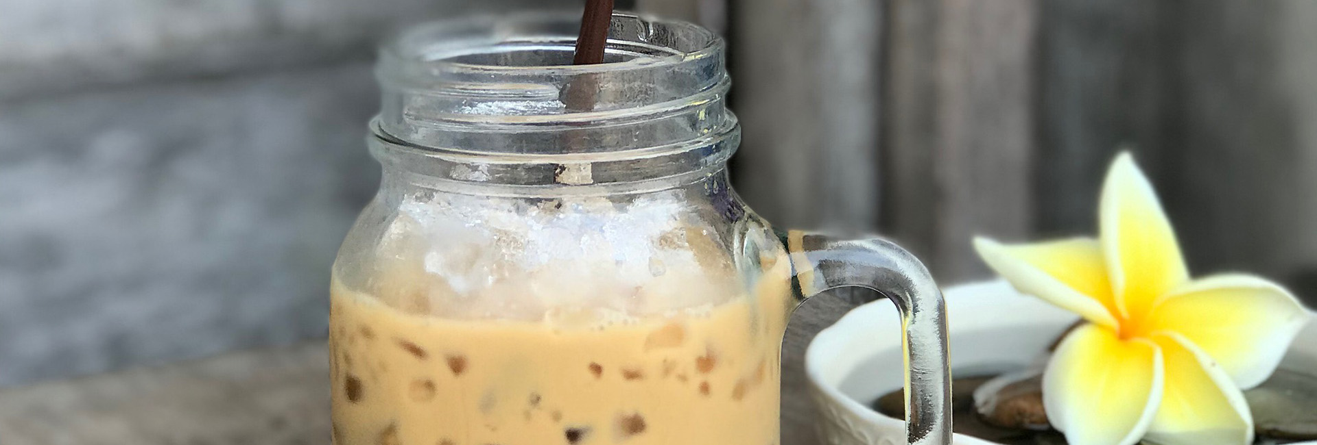 photo of an iced coffee in a mason jar