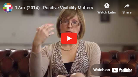 A woman speaking with her hand up in a gesture A woman speaking with her hand up in a gesture