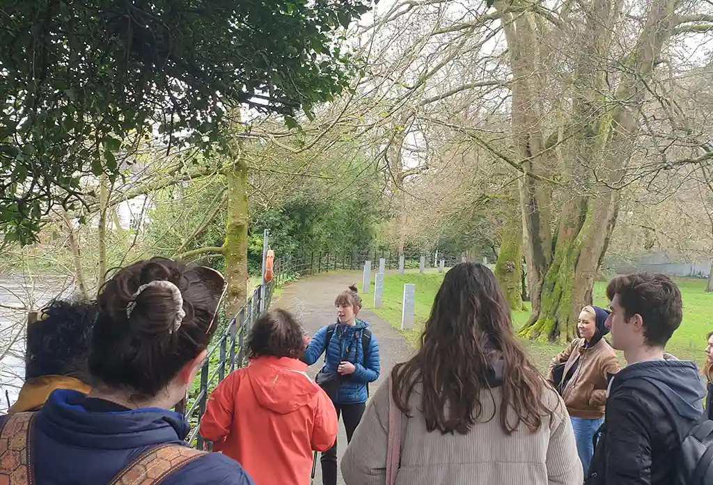 Green shoots coordinator Irene Ní Súilleabháin gives students a tour of the biodiversity trail on UCC grounds